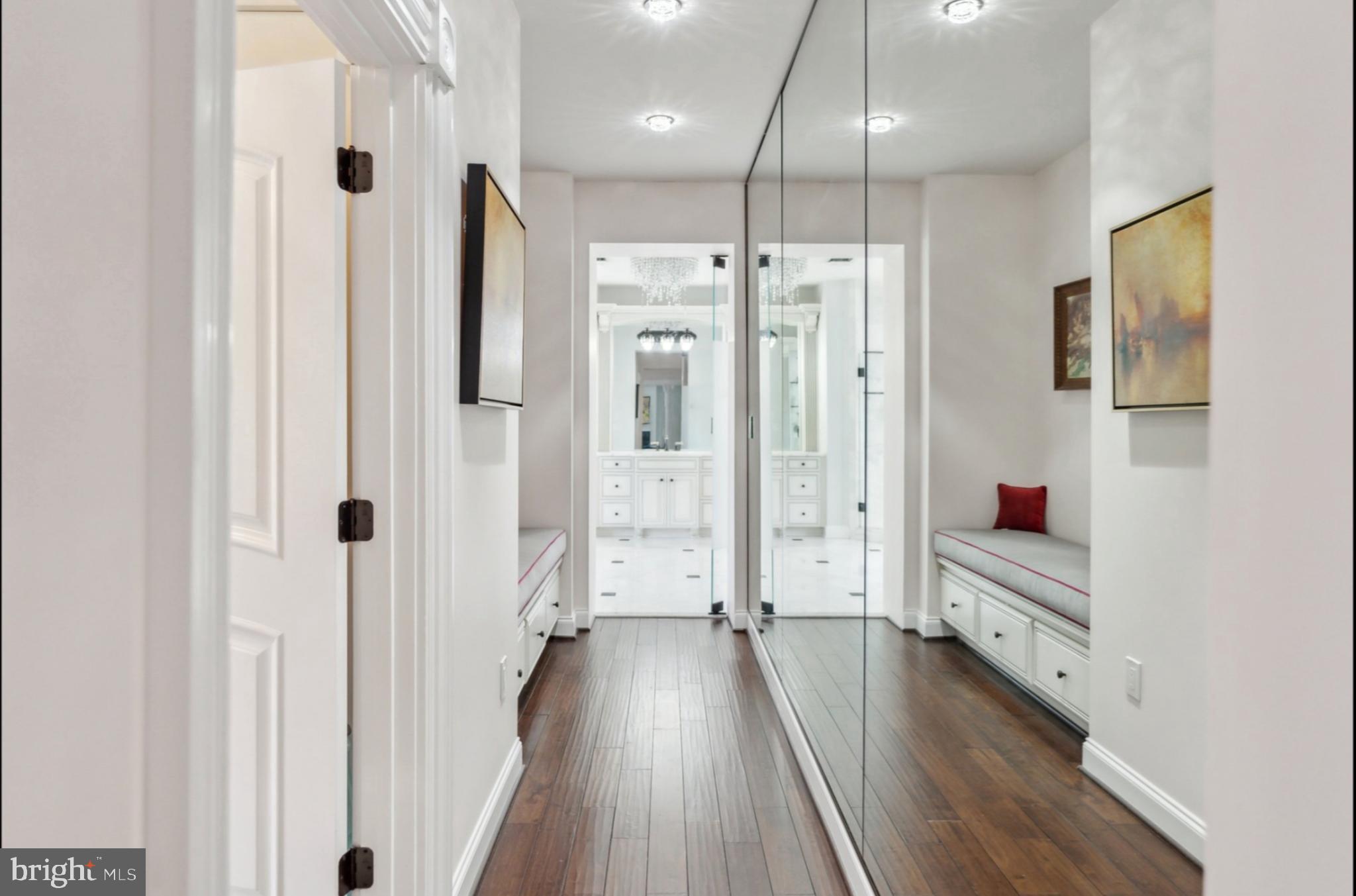 11561 Stuart Mill Road Oakton, VA 22124 - Photo 44 of 76 a view of a hallway with wooden floor and staircase
