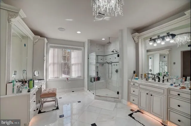 an aerial view of a house with swimming pool garden and lake view