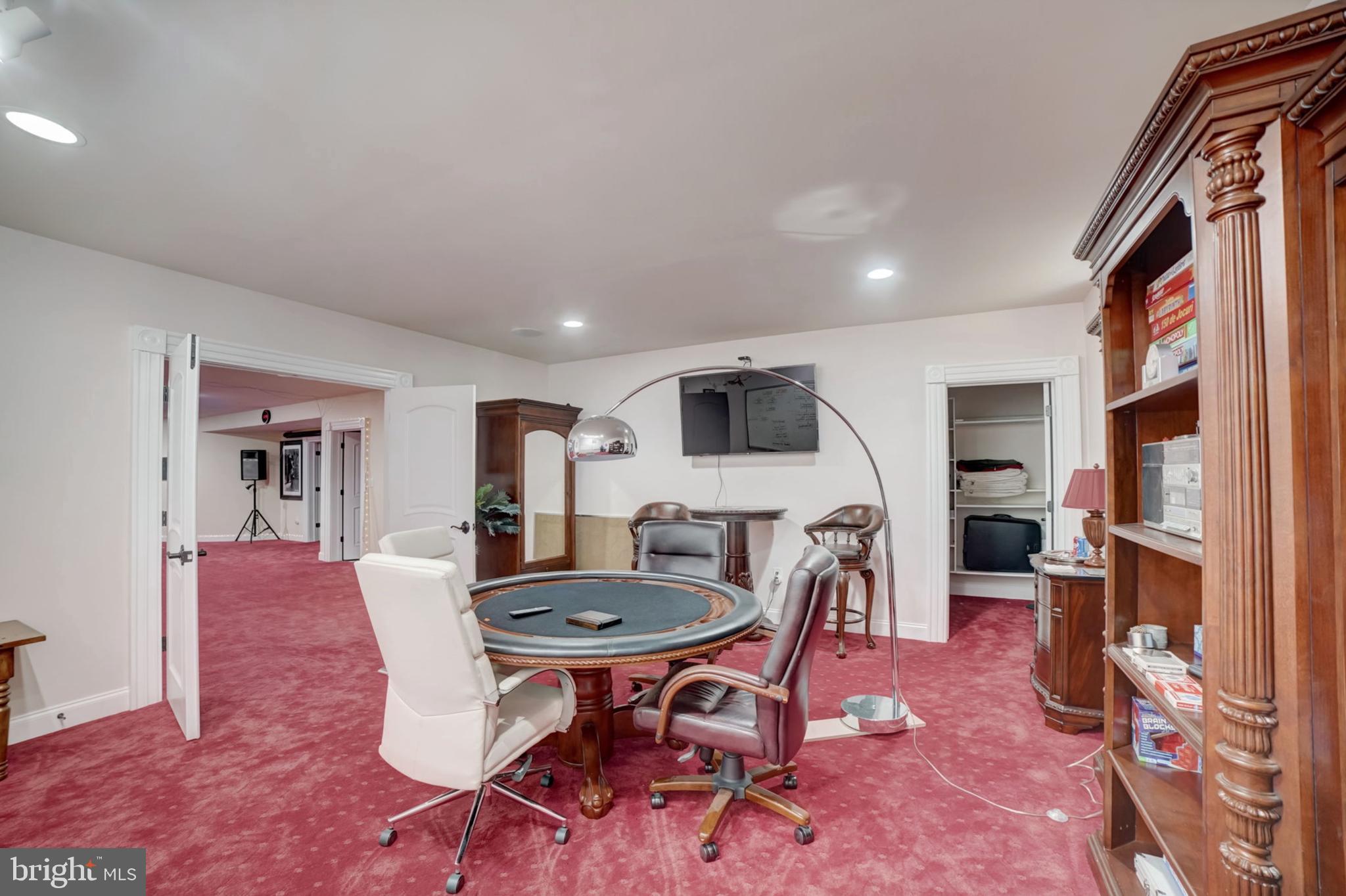 11561 Stuart Mill Road Oakton, VA 22124 - Photo 51 of 76 a living room with furniture a flat screen tv and a rug