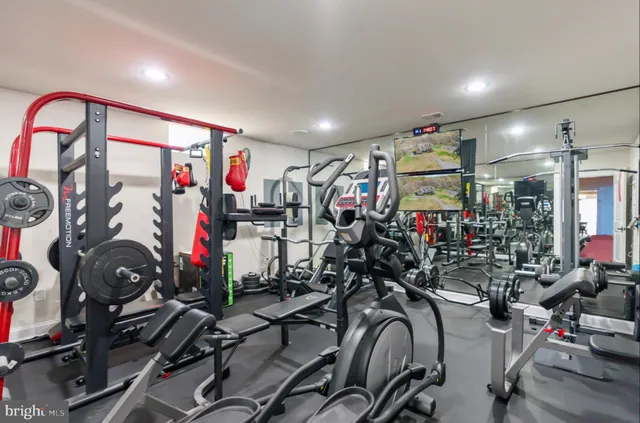 a backyard of a house with lots of green space and chair