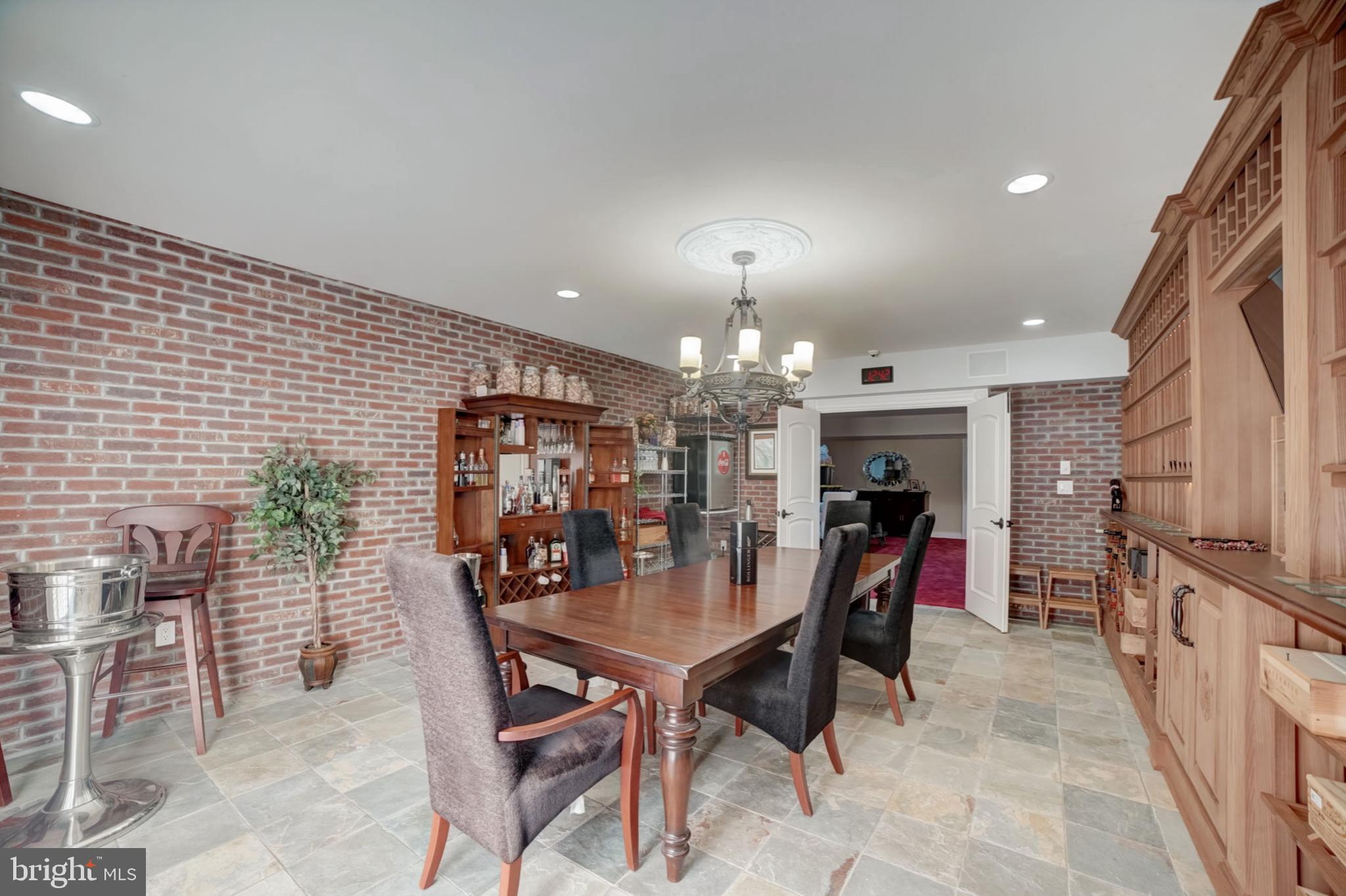 11561 Stuart Mill Road Oakton, VA 22124 - Photo 57 of 76 a view of a dining room with furniture