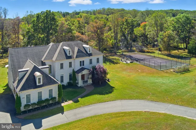 a bedroom with a large bed and a large window