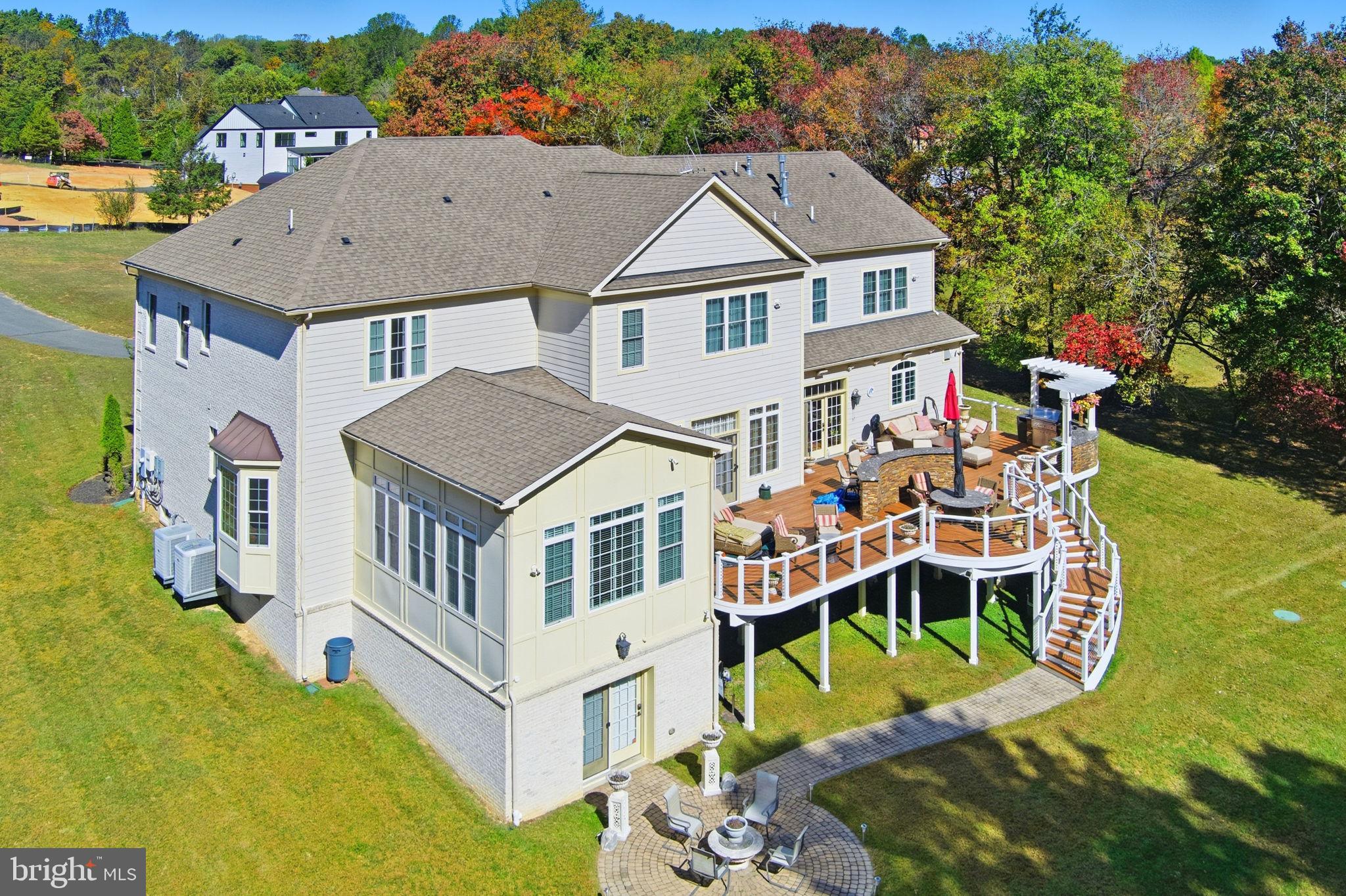 11561 Stuart Mill Road Oakton, VA 22124 - Photo 61 of 76 an aerial view of a house with swimming pool and furniture