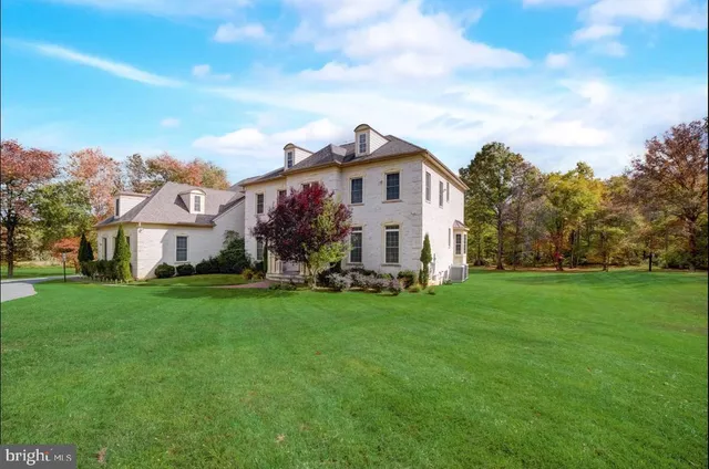 a bedroom with furniture and a wooden floor