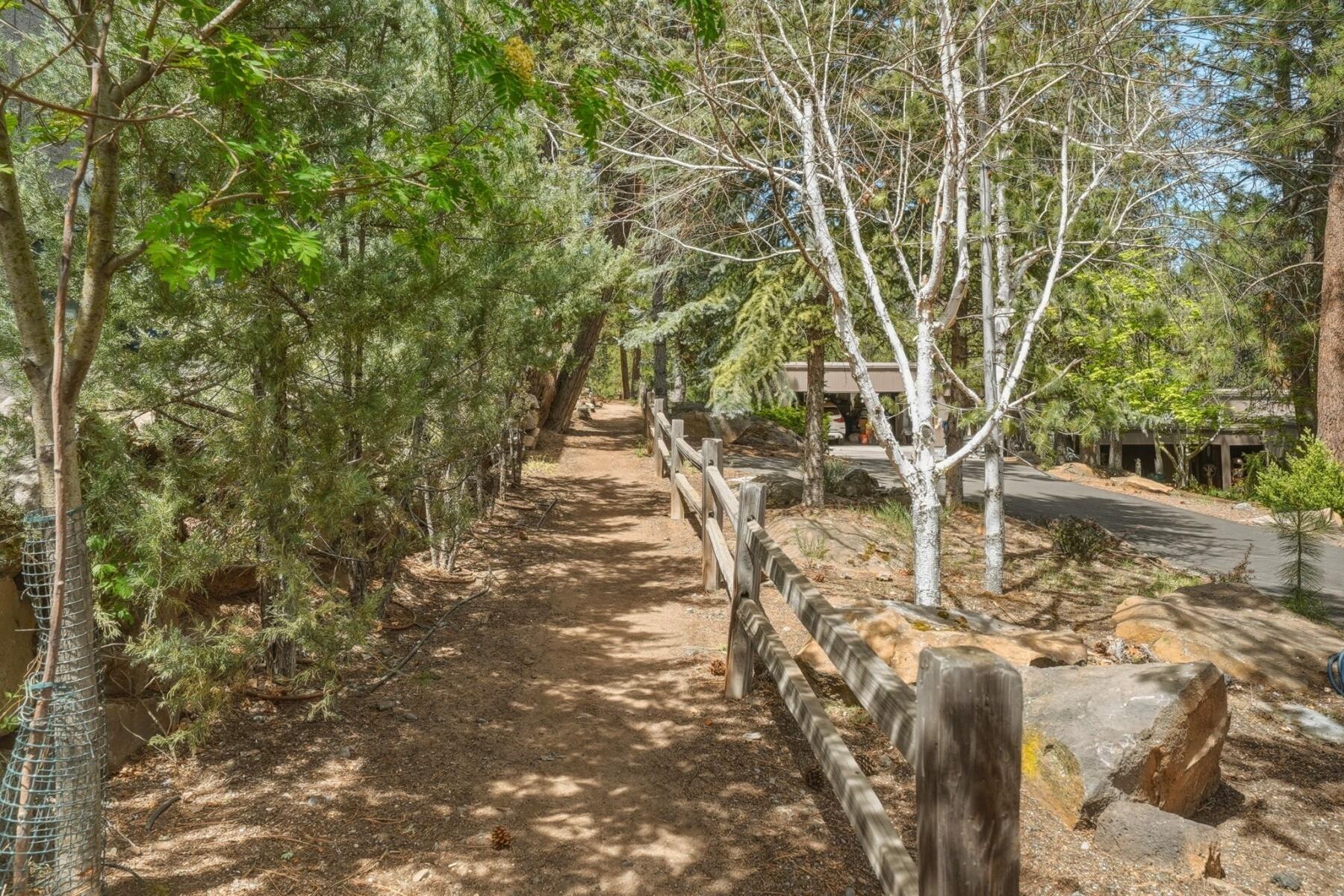 637 Northwest Silver Buckle Road Bend, OR 97703 - Photo 59 of 68 a backyard of a house with lots of green space