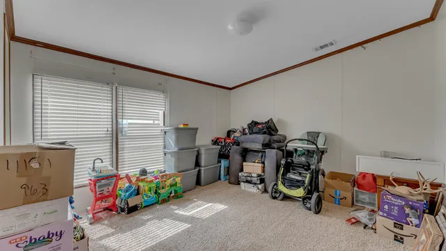 a bedroom with furniture and a window