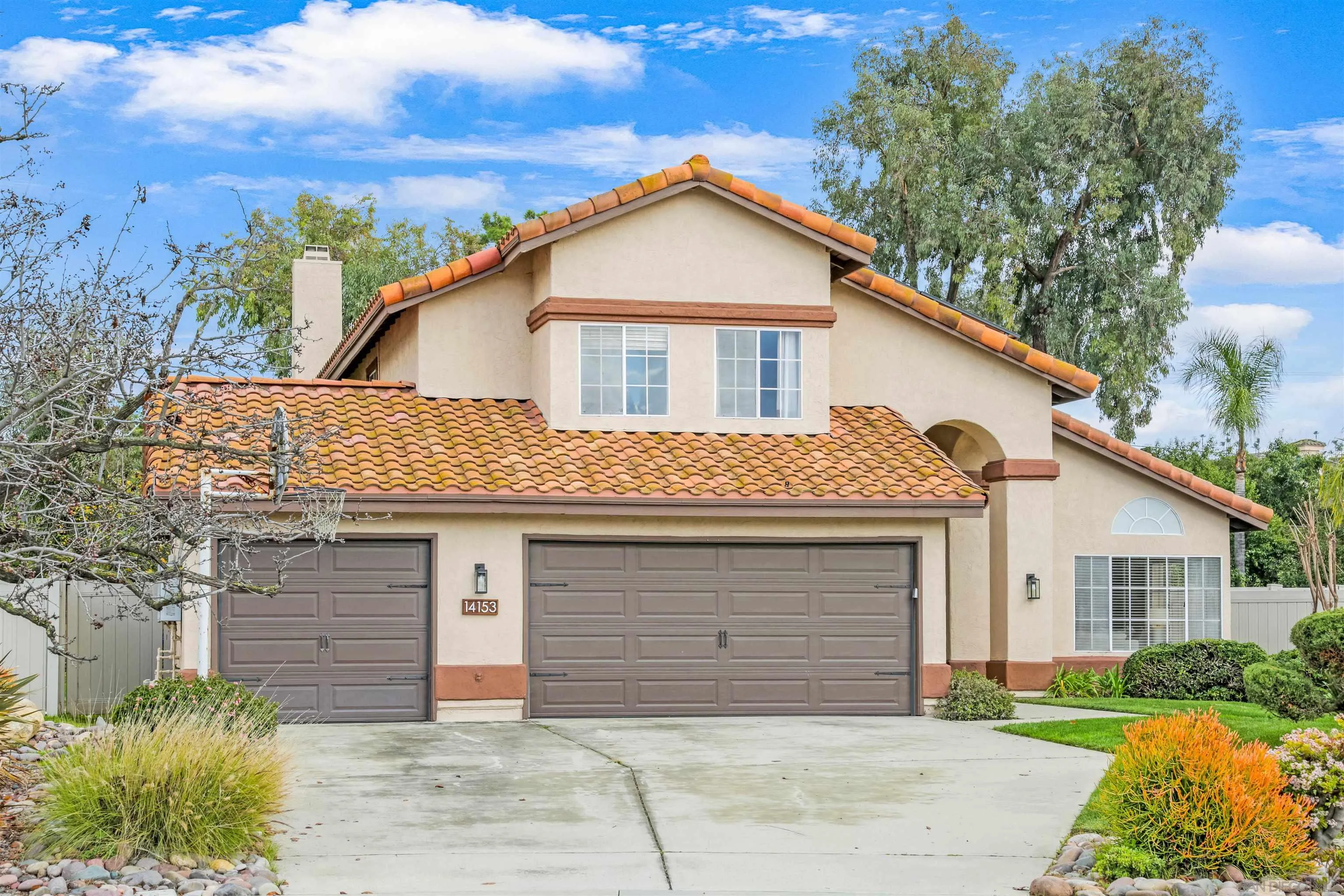 14153 Rio Court Poway, CA 92064 - Photo 1 of 48 a front view of a house with a garden