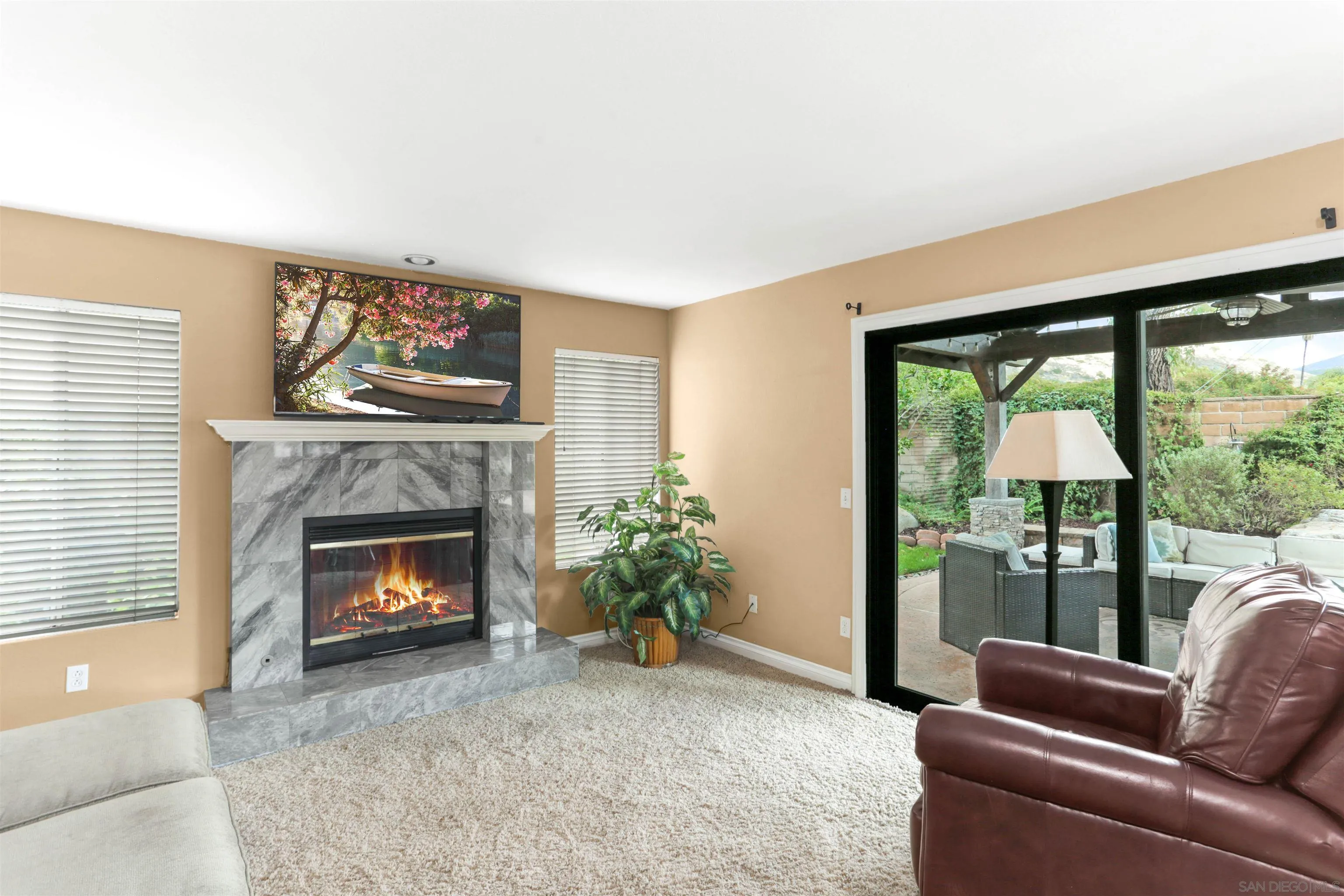 14153 Rio Court Poway, CA 92064 - Photo 18 of 48 a living room with furniture a flat screen tv and a fireplace