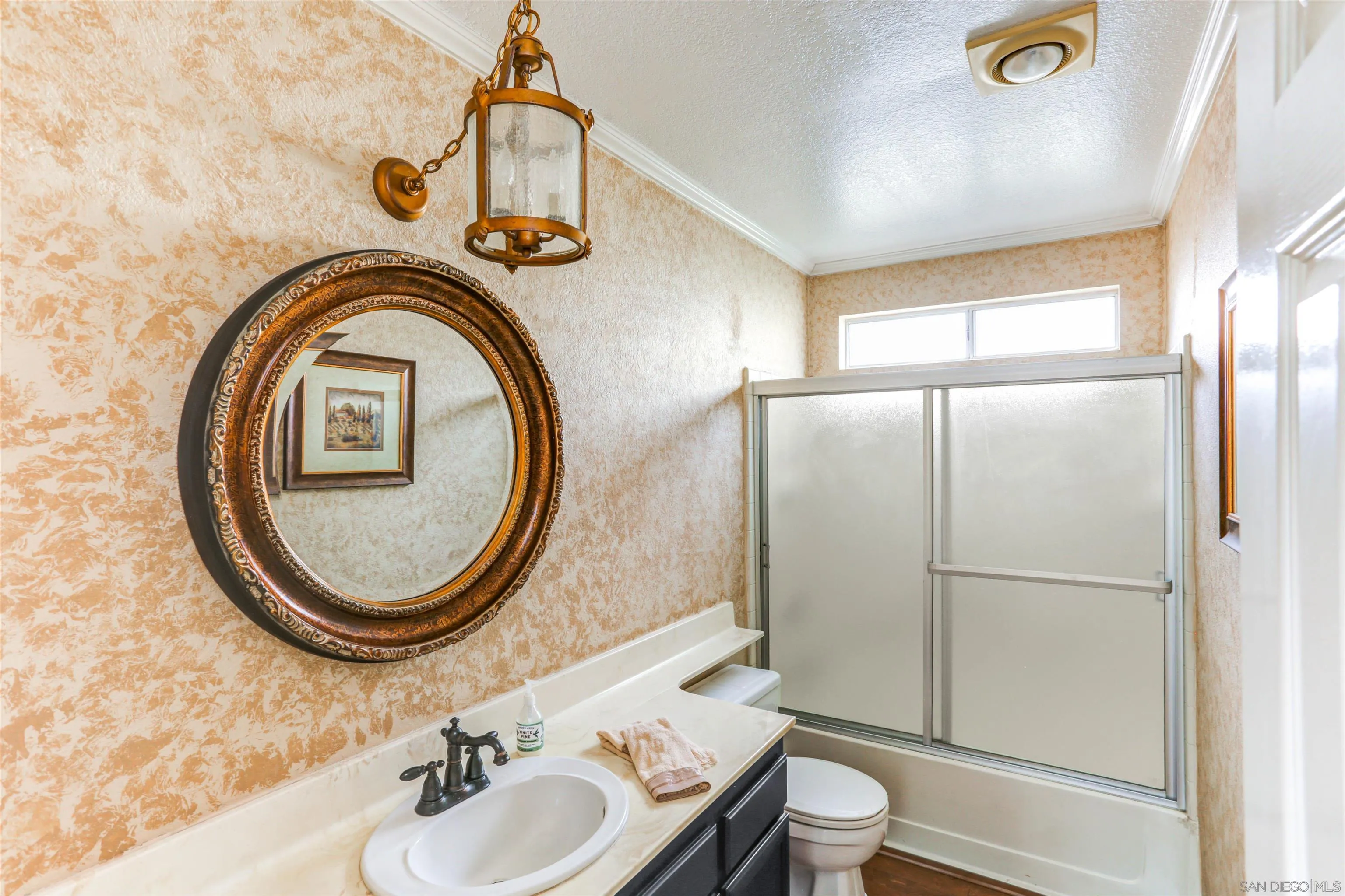14153 Rio Court Poway, CA 92064 - Photo 20 of 48 a bathroom with a granite countertop toilet a sink and a mirror