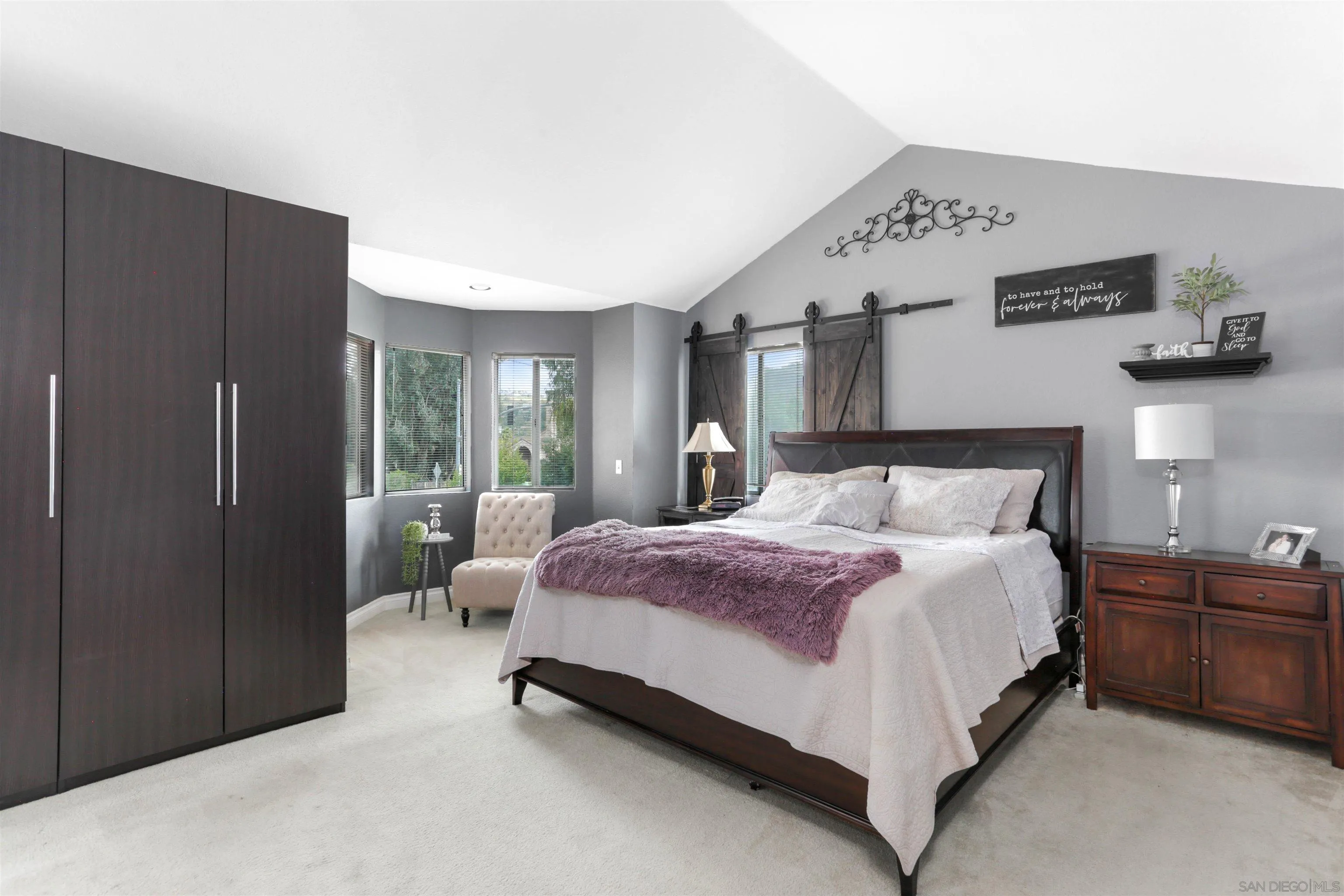 14153 Rio Court Poway, CA 92064 - Photo 31 of 48 a bedroom with a bed lamp closet and large window