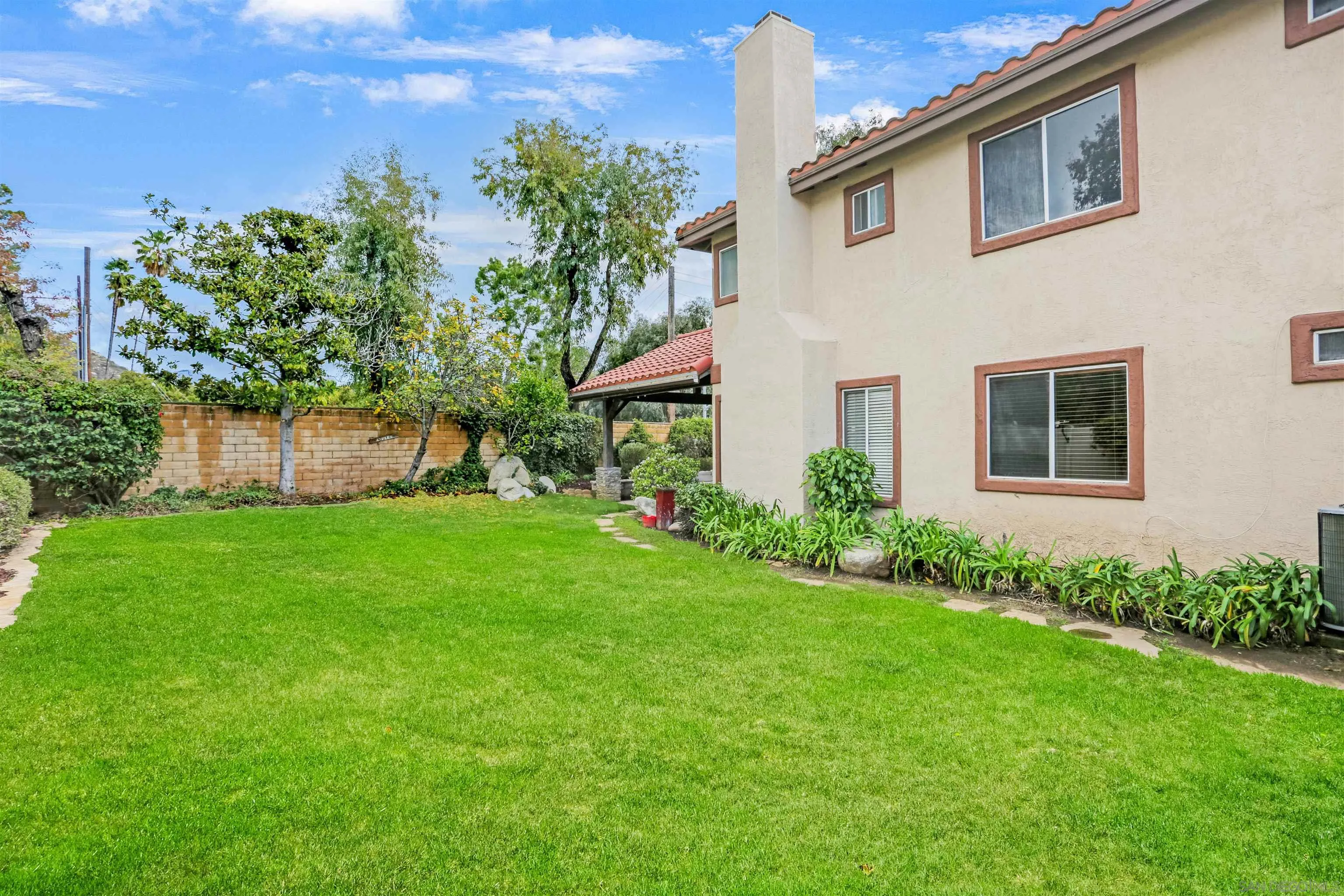 14153 Rio Court Poway, CA 92064 - Photo 48 of 48 a front view of a house with a garden