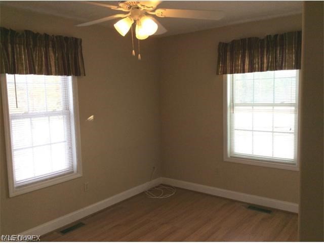 3488 Hamilton Road Medina, OH 44256 - Photo 7 of 18 1ST FLOOR BEDROOM IS HANDICAP ACCESS INCLUDING FULL BATH HAS LAMINATE FLOORING & CEILING FAN W/LIGHT.