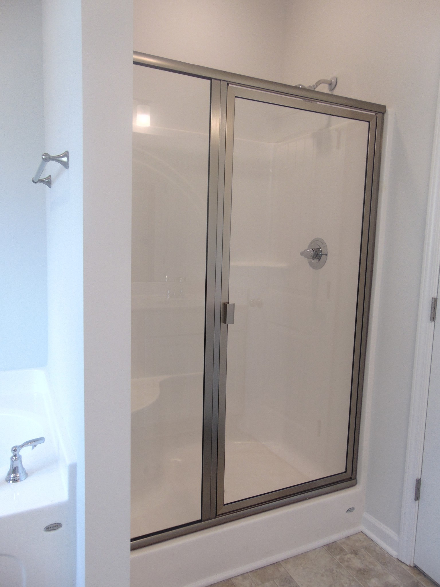281 Spring Street La Vergne, TN 37086 - Photo 15 of 26 a bathroom with a glass shower door