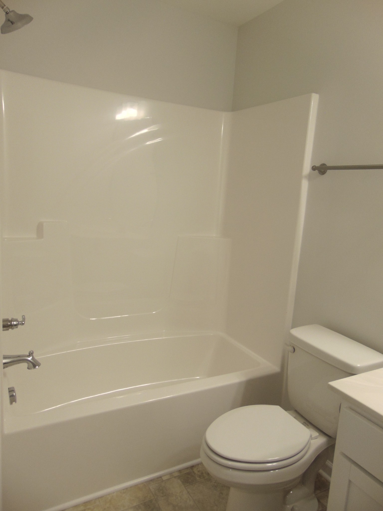281 Spring Street La Vergne, TN 37086 - Photo 23 of 26 a white toilet sitting next to a bath tub