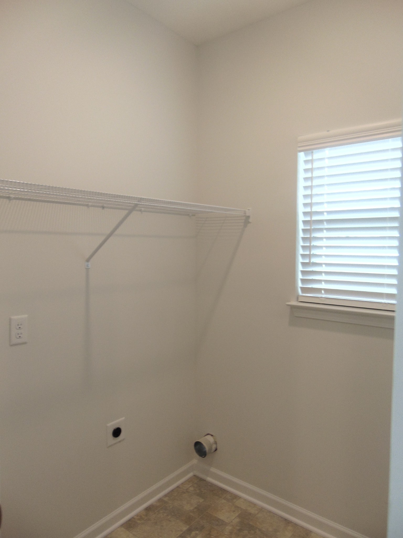 281 Spring Street La Vergne, TN 37086 - Photo 6 of 26 a view of a small space with racks on the wall