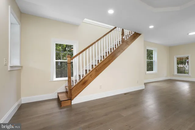 a view of an entryway with wooden floor
