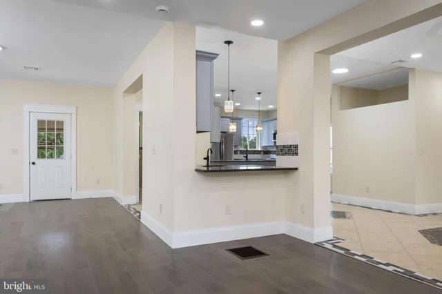 a view of kitchen with wooden floor