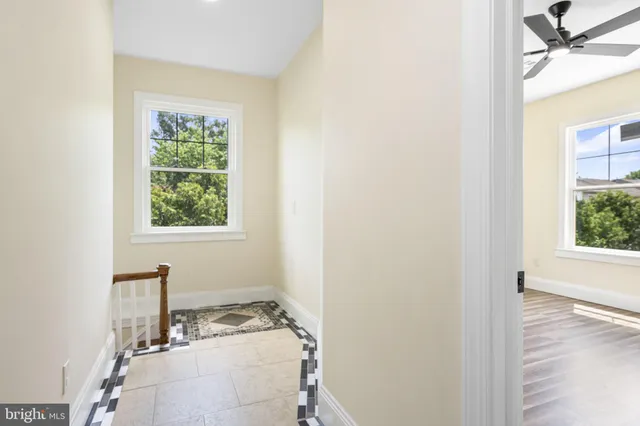 a bathroom with a sink a window and a mirror