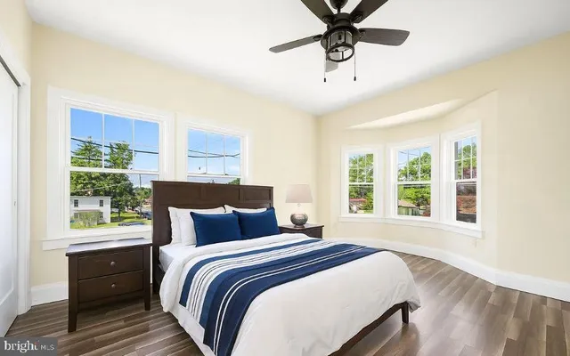 a bedroom with a bed and window