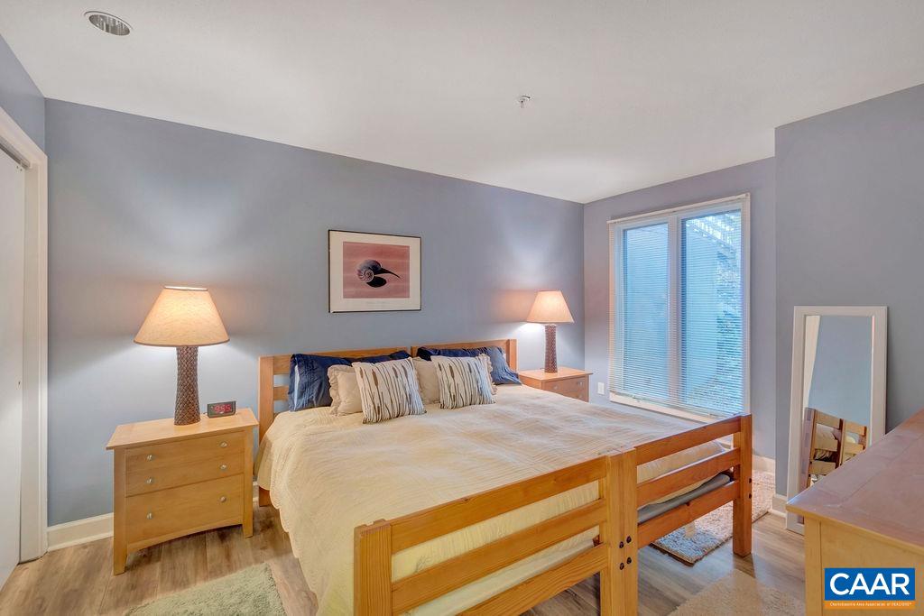 2073 Stone Ridge Wintergreen, VA 22967 - Photo 15 of 33 a bedroom with a bed and a lamp on table