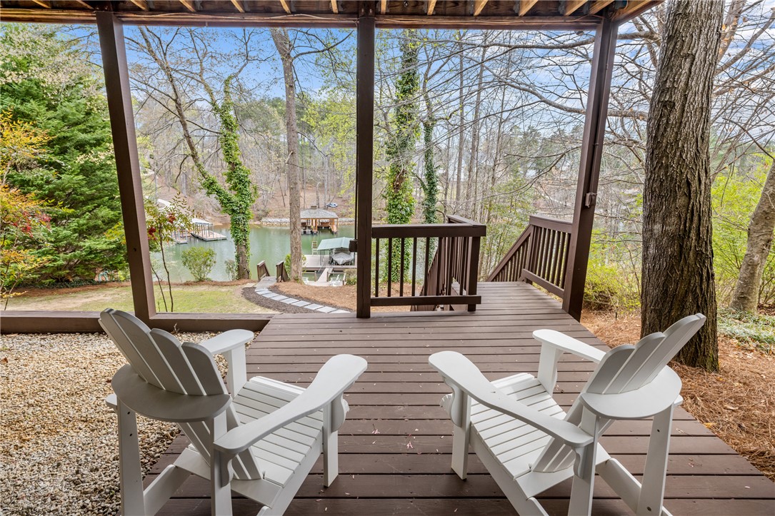 203 Little Lane Seneca, SC 29672 - Photo 32 of 48 This inviting porch offers tranquil views of the serene waterfront.