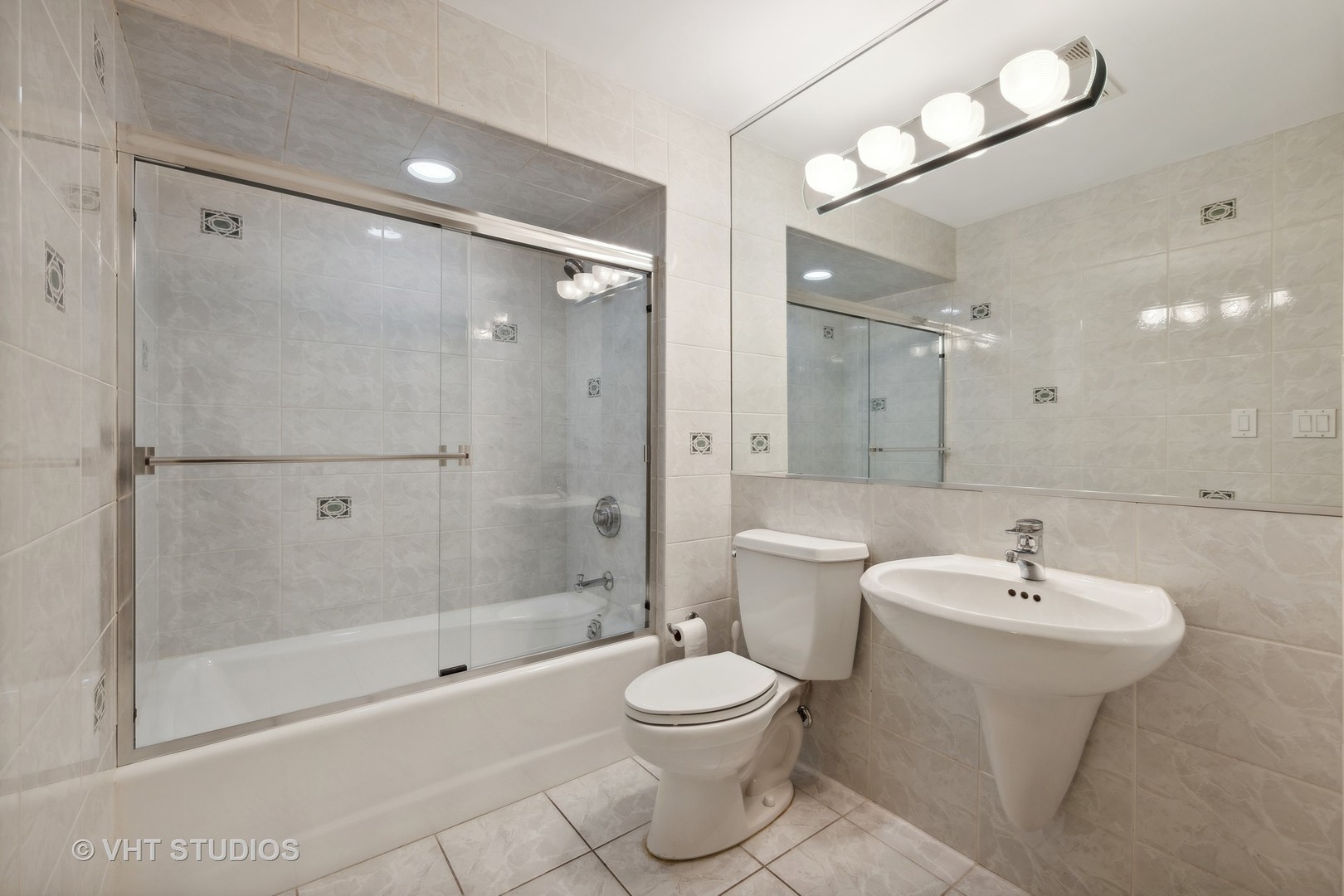 6705 Fieldstone Drive Burr Ridge, IL 60527 - Photo 19 of 41 a bathroom with a sink toilet and shower