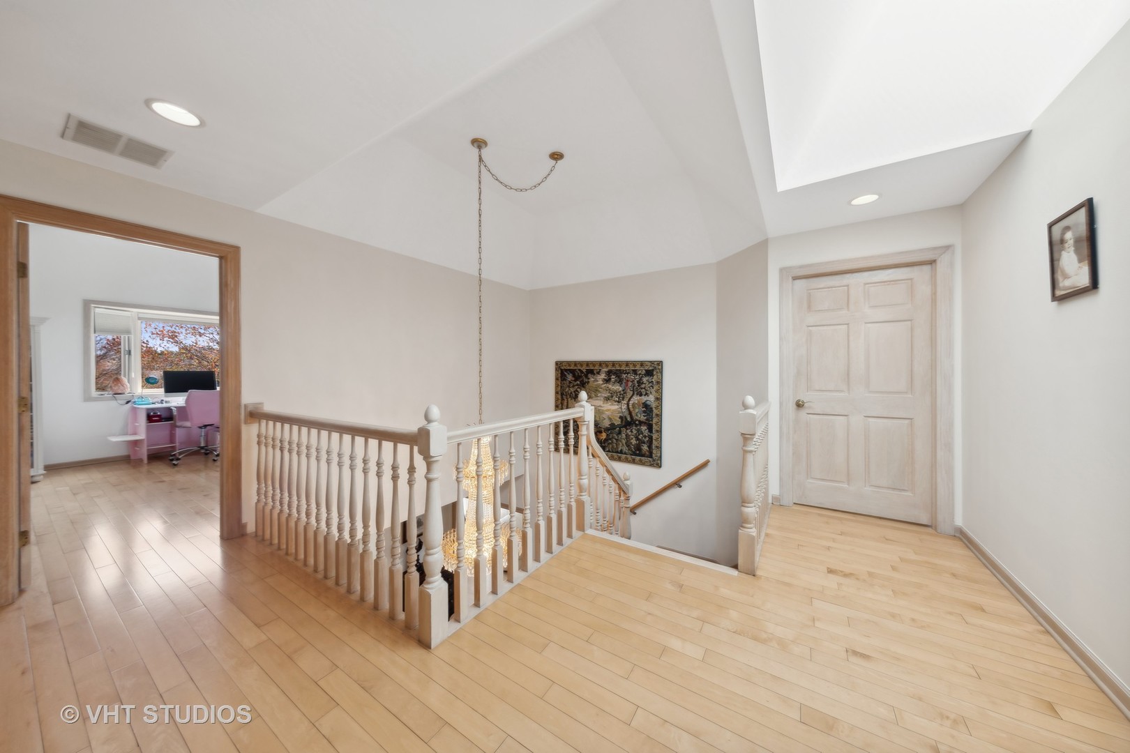 6705 Fieldstone Drive Burr Ridge, IL 60527 - Photo 25 of 41 a view of a hallway with wooden floor windows and fireplace