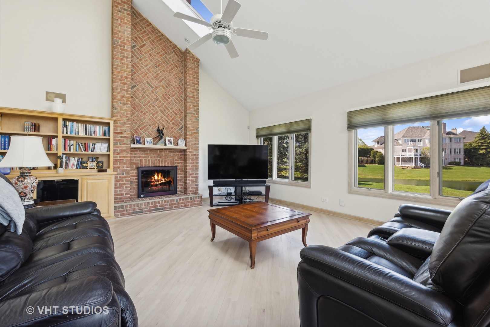 6705 Fieldstone Drive Burr Ridge, IL 60527 - Photo 36 of 41 a living room with furniture a flat screen tv and a fireplace