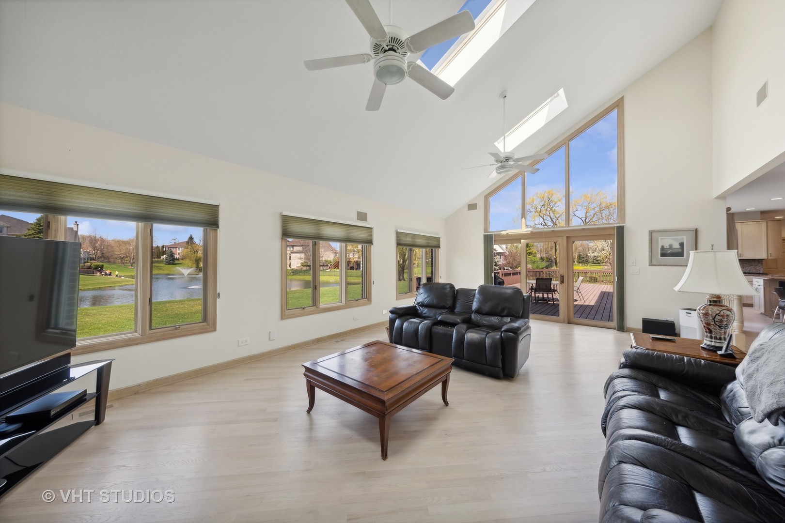 6705 Fieldstone Drive Burr Ridge, IL 60527 - Photo 37 of 41 a living room with furniture large window and flat screen tv