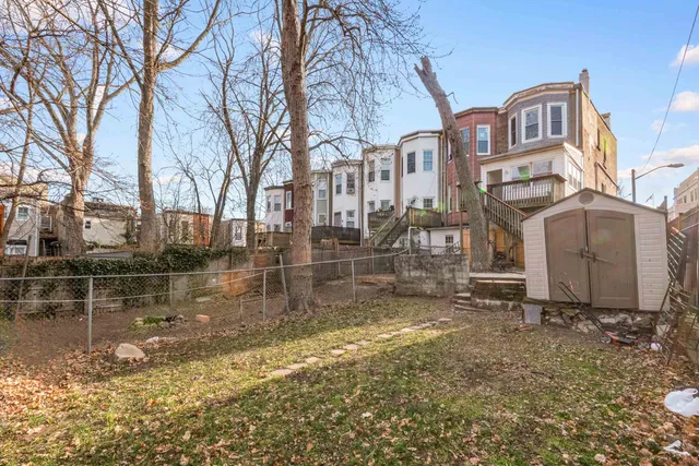 a view of a town with large trees