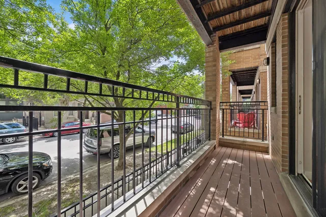 a view of balcony with wooden floor