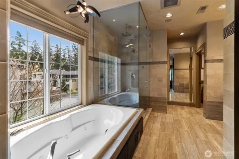 a view of room with window and wooden floor