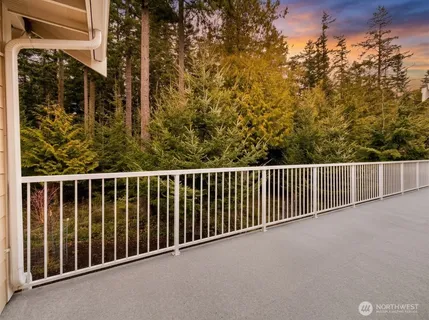 a kitchen with stainless steel appliances granite countertop a refrigerator a sink and a stove