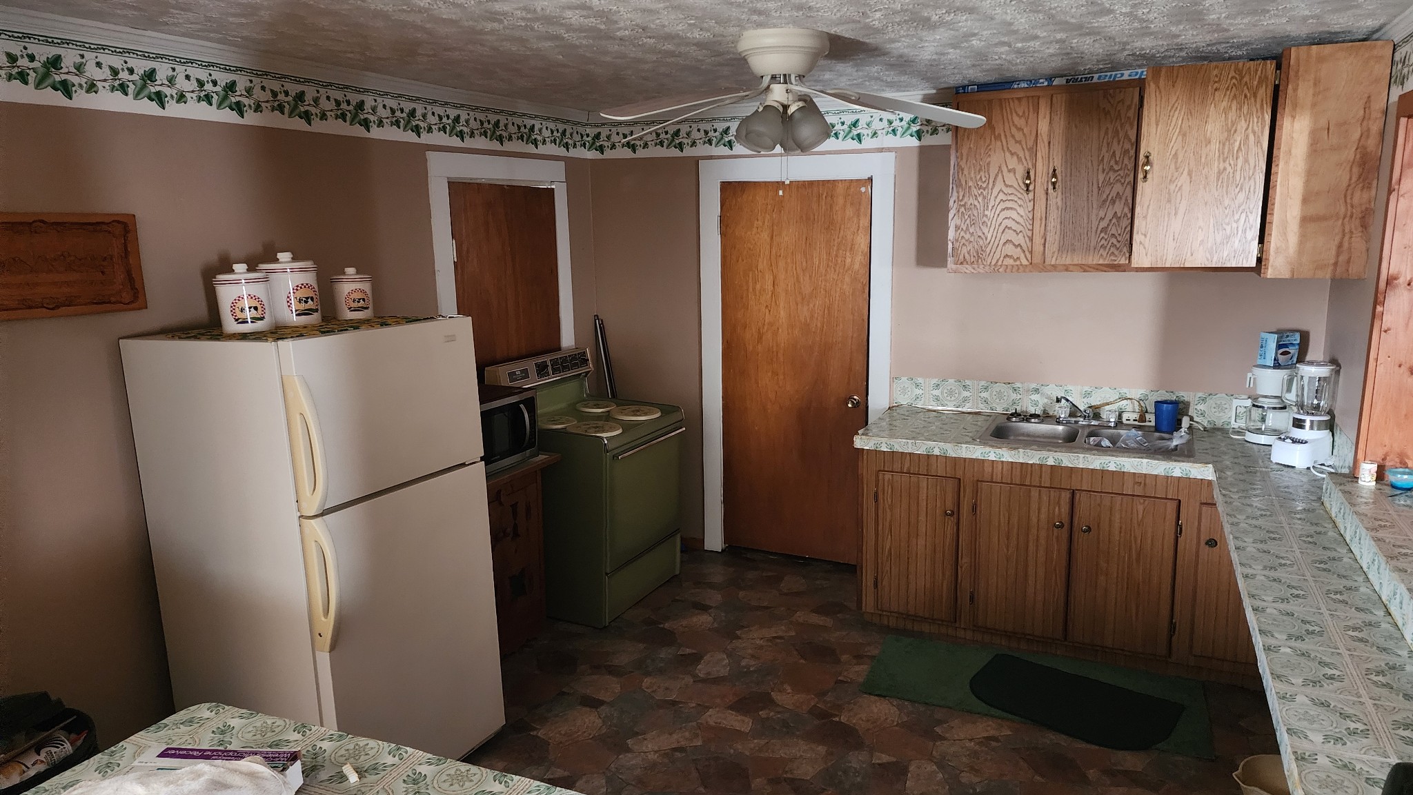 194 Allen's Chapel Road Smithville, TN 37166 - Photo 9 of 13 a kitchen with stainless steel appliances granite countertop a refrigerator and a sink