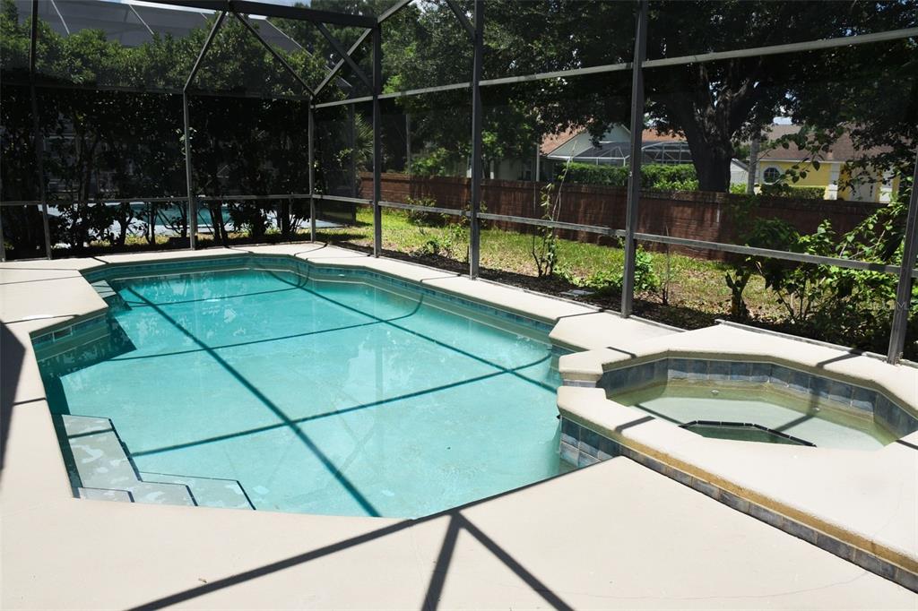 2807 Playing Otter Court Kissimmee, FL 34747 - Photo 21 of 25 a view of a chair and tables in the patio