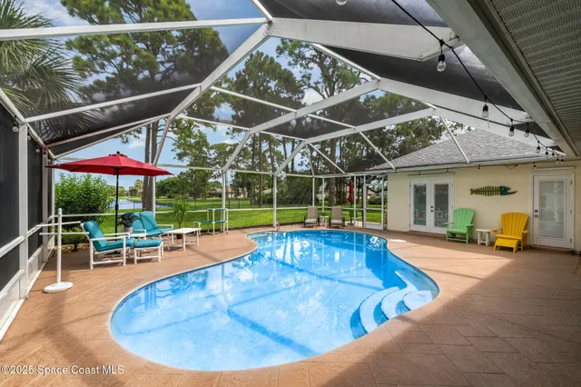 an outdoor sitting area with furniture