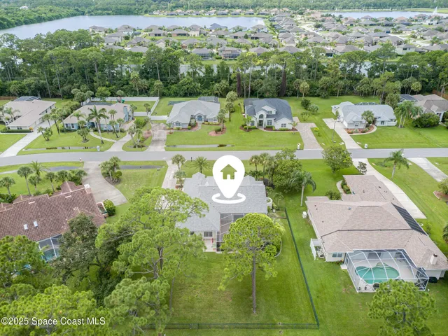 an aerial view of a house with a garden