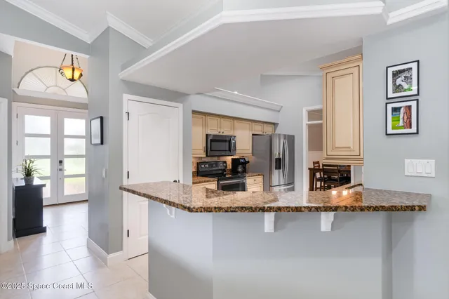 a view of living room with granite countertop furniture and fireplace