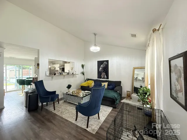 a living room with furniture and a table