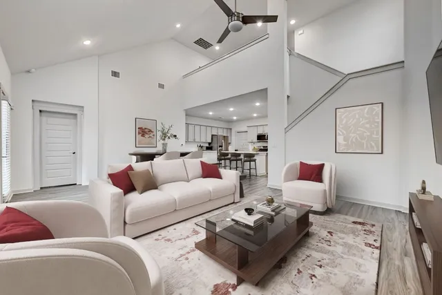 a living room with furniture and a table
