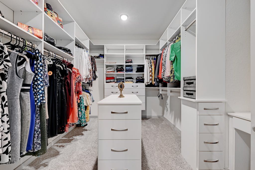 7517 Peggie Nell Drive Austin, TX 78724 - Photo 15 of 37 a view of walk in closet with clothes and shoes
