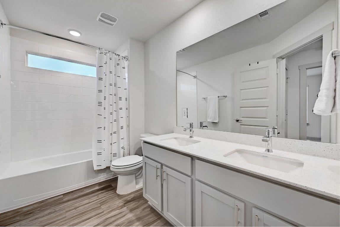 7517 Peggie Nell Drive Austin, TX 78724 - Photo 23 of 37 a bathroom with a sink toilet and shower