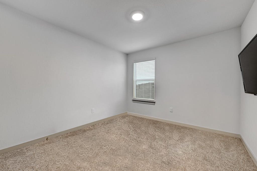 7517 Peggie Nell Drive Austin, TX 78724 - Photo 24 of 37 an empty room with windows
