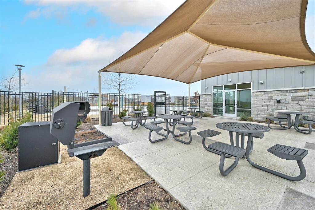 7517 Peggie Nell Drive Austin, TX 78724 - Photo 32 of 37 a view of a patio with chairs and tables
