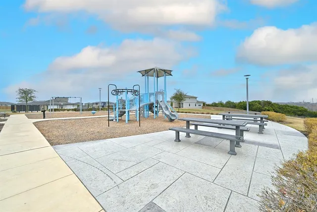 a view of a patio with chairs and tables