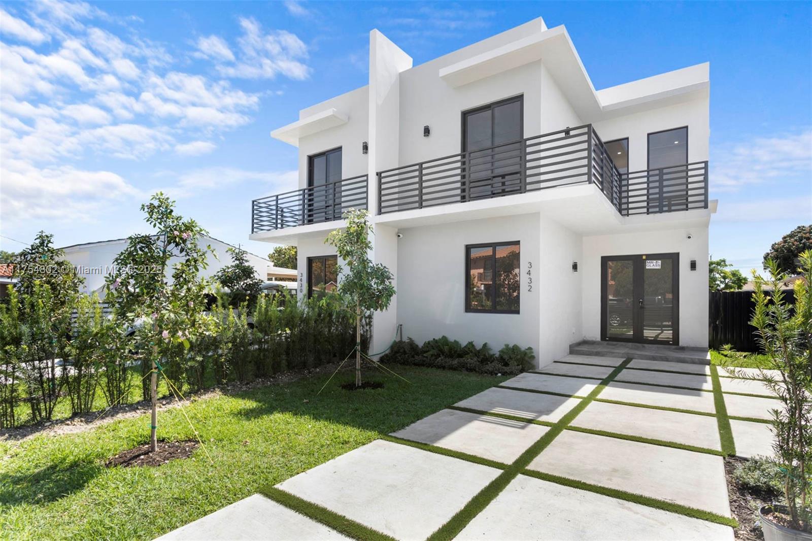 3430 Southwest 2nd Street Miami, FL 33135 - Photo 1 of 42 a view of a house with a yard