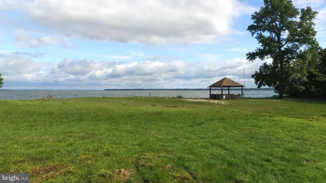 a view of house with garden and deck