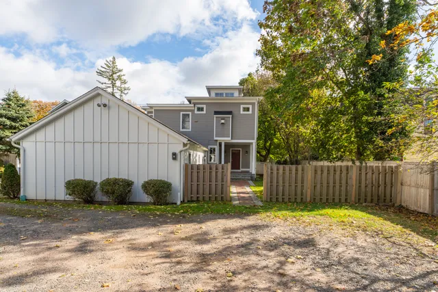 a view of a house with backyard and plants