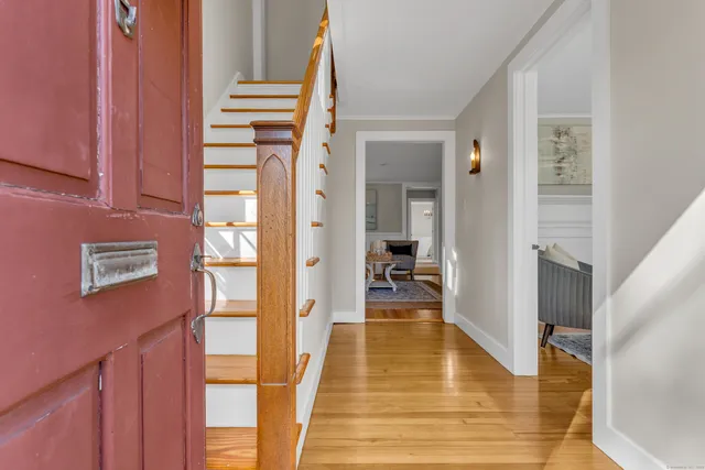 a bathroom with a bathtub and a hallway