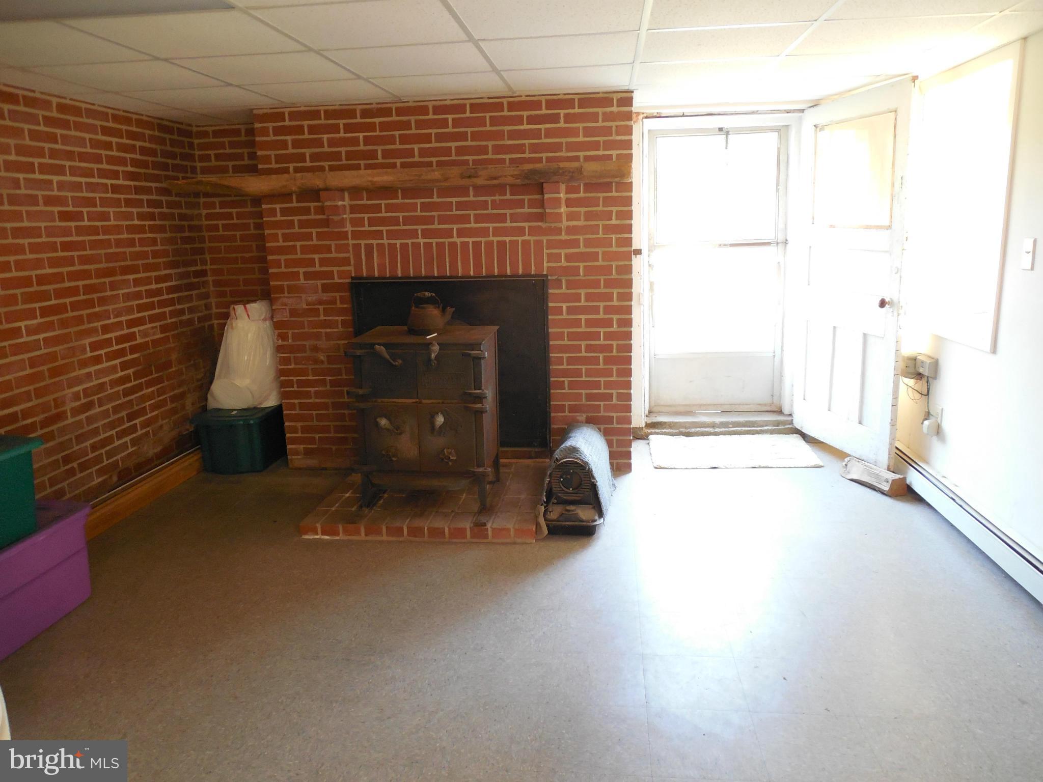 416 High Street New Windsor, MD 21776 - Photo 20 of 20 Woodstove in recroom area.